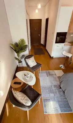 a living room with a table and two chairs at Residence in Belgrade