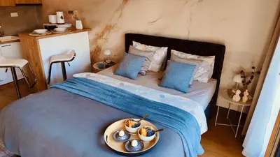 a bedroom with a bed with a bowl of food on it at Residence in Belgrade