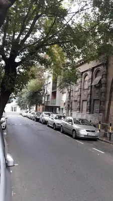 a row of cars parked on the side of a street at Apartment Avala in Belgrade