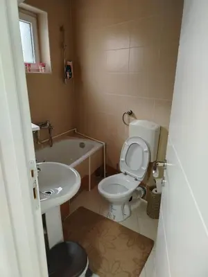 a small bathroom with a toilet and a sink at STAN NA DAN - Garsonjera PRAMAC in Žarkovo