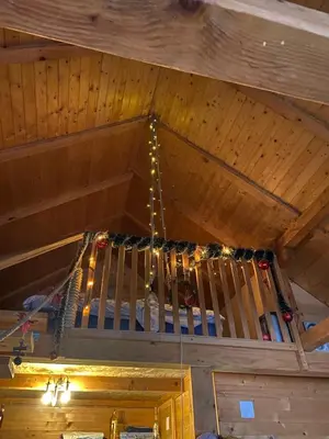 a chandelier hanging from the ceiling of a cabin at Bird of Paradise in Belgrade