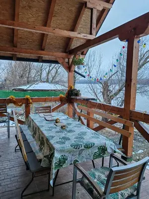 a table and chairs sitting on a patio with a table at Bird of Paradise in Belgrade