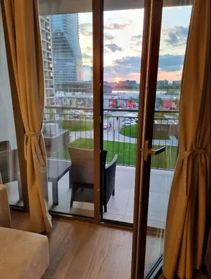a room with a sliding glass door with a view at Beograd Waterfront Verde in Belgrade