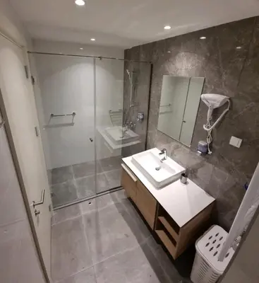 a bathroom with a sink and a shower at Beograd Waterfront Verde in Belgrade