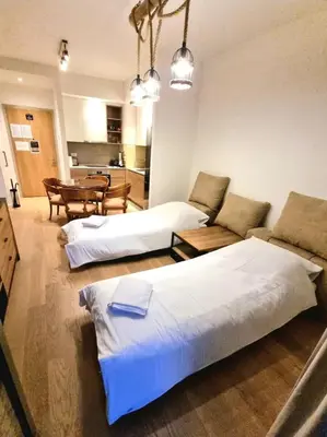 a living room with two beds and a couch at Beograd Waterfront Verde in Belgrade
