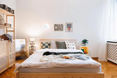 a bedroom with a large bed in a room at Musical Shelter with Balcony 2min to Republic Square in Belgrade