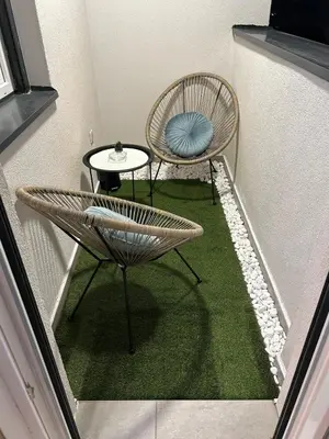 a small room with two chairs and a table at Diamond airport JACUZZI&SAUNA apartman Ledine in Ledine