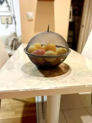 a bowl of fruit sitting on a table at Mara apartment, Belgrade, New belgrade in Belgrade