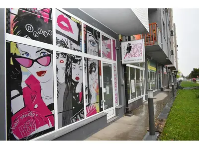 a building with posters on the side of it at Mara apartment, Belgrade, New belgrade in Belgrade