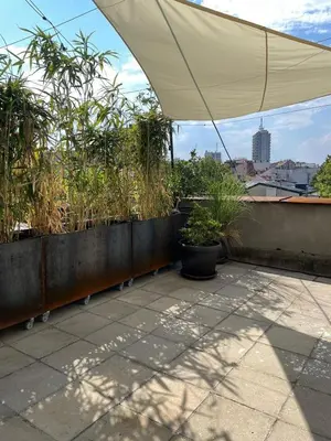 a tent on top of a roof with plants at BGLAB Small Rooftop in Belgrade