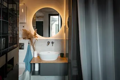 a bathroom with a sink and a mirror at BGLAB Small Rooftop in Belgrade