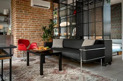 a living room with a couch and a table at BGLAB Small Rooftop in Belgrade