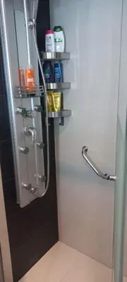 a bathroom with a shower with a glass door at Perfect place to stay in Belgrade