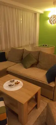 a living room with a couch and a table at Perfect place to stay in Belgrade