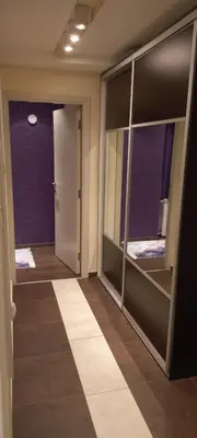 a hallway with glass doors and purple walls at Perfect place to stay in Belgrade