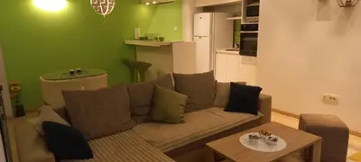 a living room with a couch and a table at Perfect place to stay in Belgrade