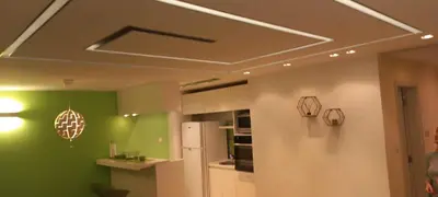 a kitchen with green walls and a ceiling at Perfect place to stay in Belgrade