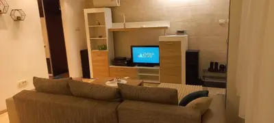 a living room with a couch and a television at Perfect place to stay in Belgrade