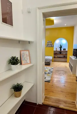 a hallway of a house with white shelves at Skadarlija Retro Charming Apartment in Belgrade