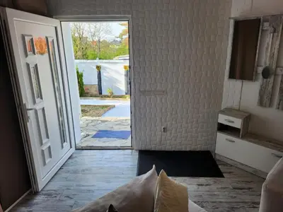 an open door leading to a room with a door at Spa Apartment Family Belgrad in Brestovik