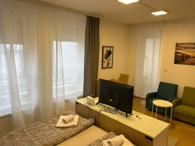 a living room with a tv and a couch at Apartment Premier 3 Belville in Belgrade