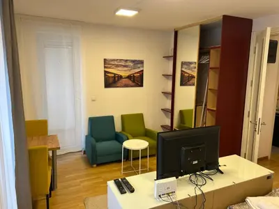 a living room with a tv on a table at Apartment Premier 3 Belville in Belgrade