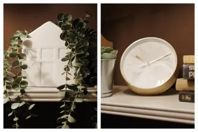 a clock sitting on a table next to a plant at Melody View with Balcony 2min to National Assembly in Belgrade