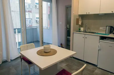 a kitchen with a table with a hat on it at Studio Anrora 1 in Belgrade
