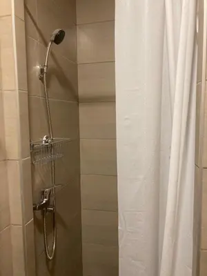 a shower in a bathroom with a shower curtain at Studio Anrora 1 in Belgrade