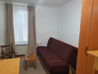 a living room with a couch and a table at Ozon in Belgrade