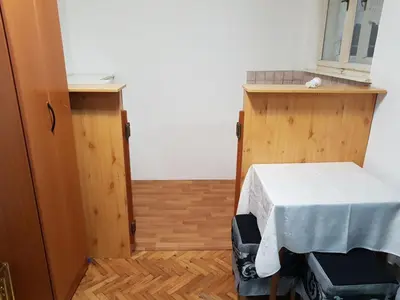 a room with a table with a white table cloth at Ozon in Belgrade