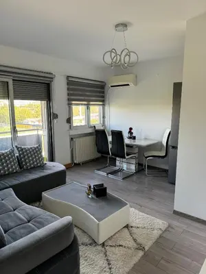 a living room with a couch and a table at Marakana in Belgrade