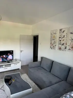 a living room with a couch and a tv at Marakana in Belgrade