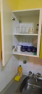 a kitchen with a sink and a counter top at Apartman Mikica in Pančevo