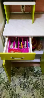 a drawer in a cabinet filled with utensils at Apartman Mikica in Pančevo
