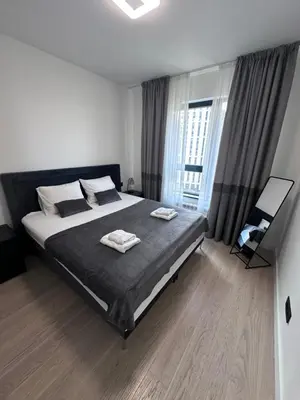 a bedroom with a bed with two towels on it at Waterfront Belgrade Peaceful Nest Apartment in Belgrade