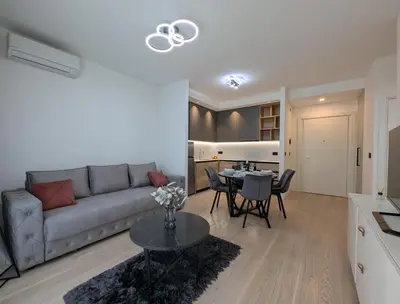 a living room with a couch and a table at Waterfront Belgrade Peaceful Nest Apartment in Belgrade