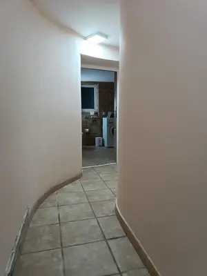 an empty room with a hallway with a tile floor at Rustic central in Belgrade