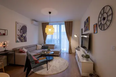 a living room with a couch and a table at Belgrade Waterfront Lux in Belgrade