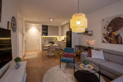 a living room with a couch and a table at Belgrade Waterfront Lux in Belgrade