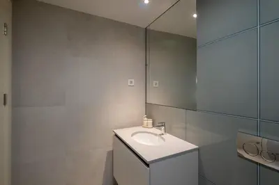 a bathroom with a sink and a mirror at Belgrade Waterfront Lux in Belgrade