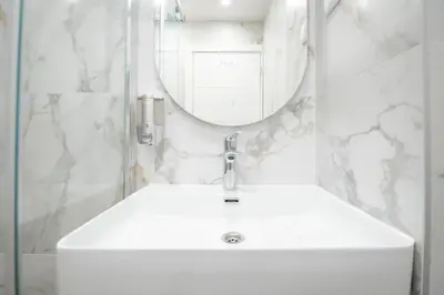 a bathroom with a white sink and a mirror at Boho House Skadarlija in Belgrade