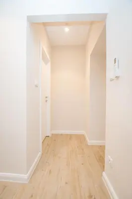 an empty room with white walls and wooden floors at Boho House Skadarlija in Belgrade