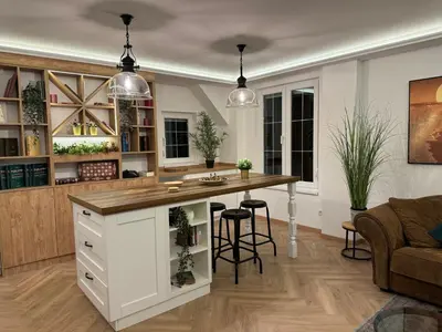a kitchen with a large island with a counter at Romero Velvet Nights in Belgrade