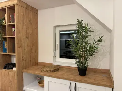 a room with a window and a plant on a counter at Romero Velvet Nights in Belgrade