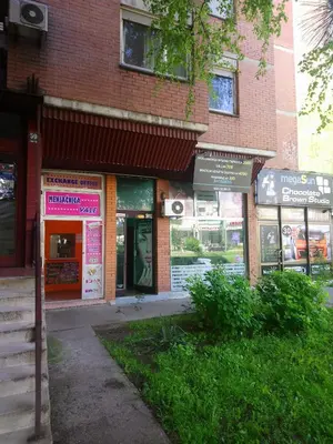 a building with a bunch of shops on a street at Bohemian Rhapsody NBG in Belgrade