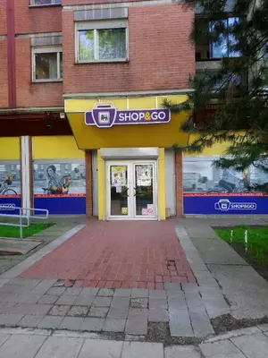 a store front with a yellow and blue storefront at Bohemian Rhapsody NBG in Belgrade