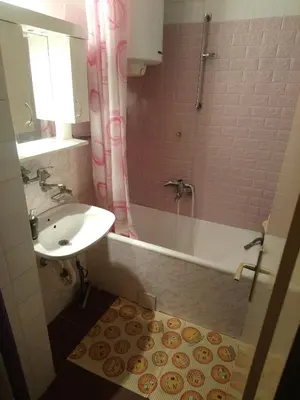 a bathroom with a sink and a tub and a shower at Bohemian Rhapsody NBG in Belgrade