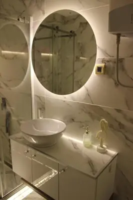 a bathroom with a sink and a mirror at Pinky Belgrade Apartment in Belgrade
