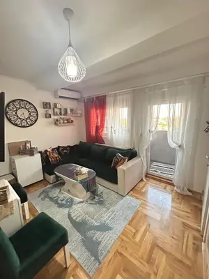 a living room with a couch and a table at Luxury apartment in Ledine